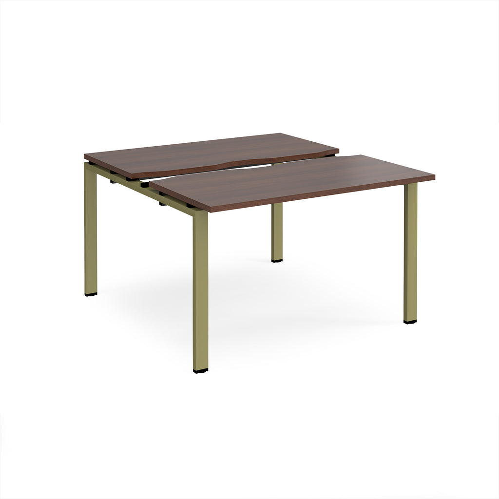 Two-person back-to-back office desk with dark wood-effect worktops and green metal legs, shown against a white background.