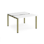 Two-person back-to-back office desk with white worktops and green metal legs, shown against a white background.