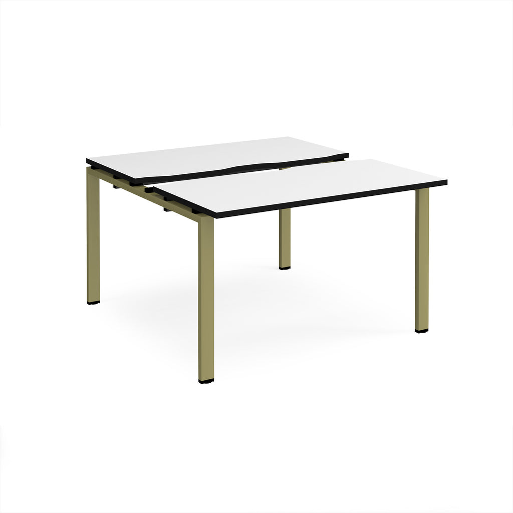 Two-person back-to-back office desk with white worktops, black edging, and green metal legs, shown against a white background.