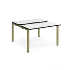 Two-person back-to-back office desk with white worktops, black edging, and green metal legs, shown against a white background.