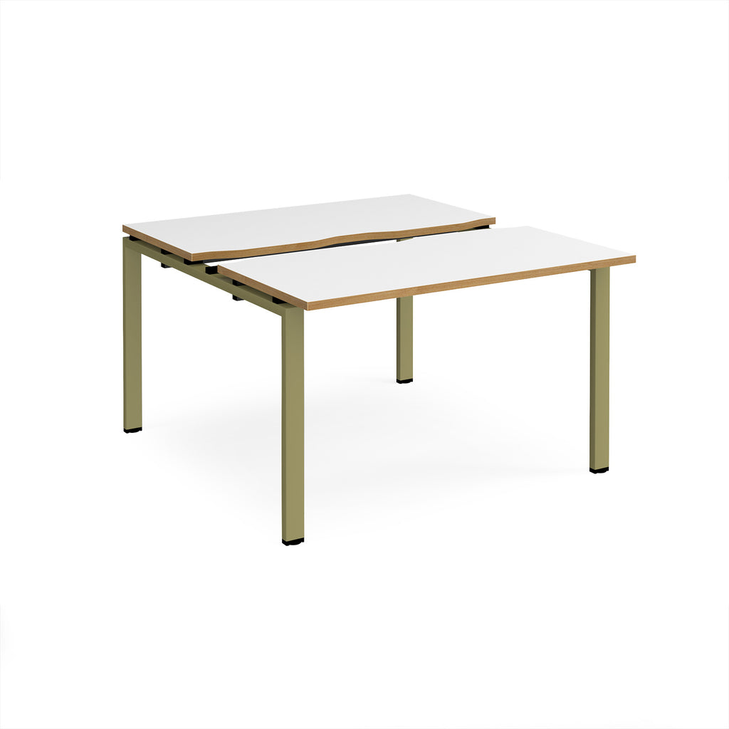 Two-person back-to-back office desk with white worktops, oak-effect edging, and green metal legs, shown against a white background.