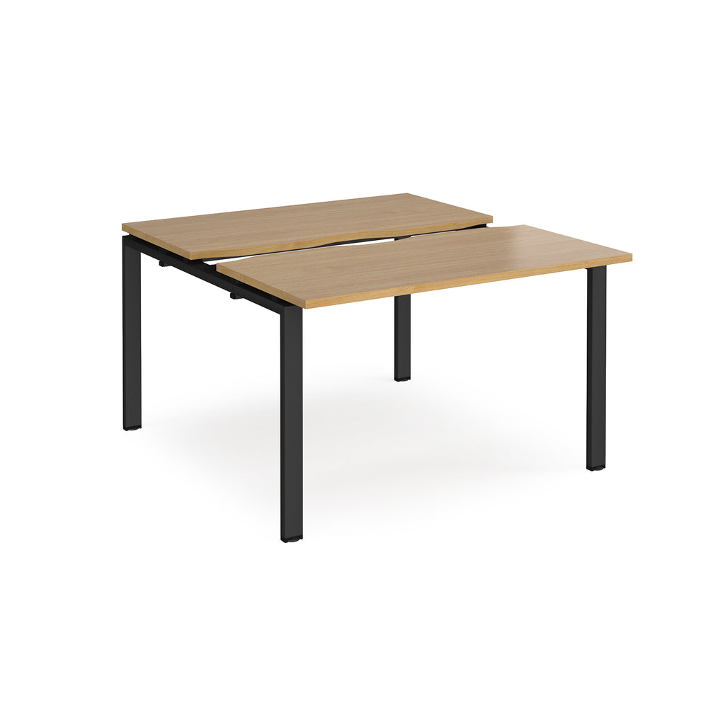 Two-person back-to-back office desk with oak-effect worktops and black metal legs, designed for shared workspace layouts.