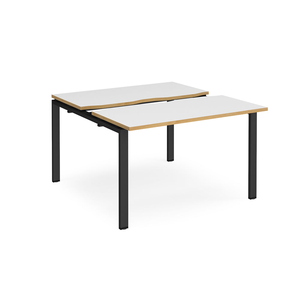 Two-person back-to-back office desk with white worktops, oak-effect edging, and black metal legs, shown against a white background.