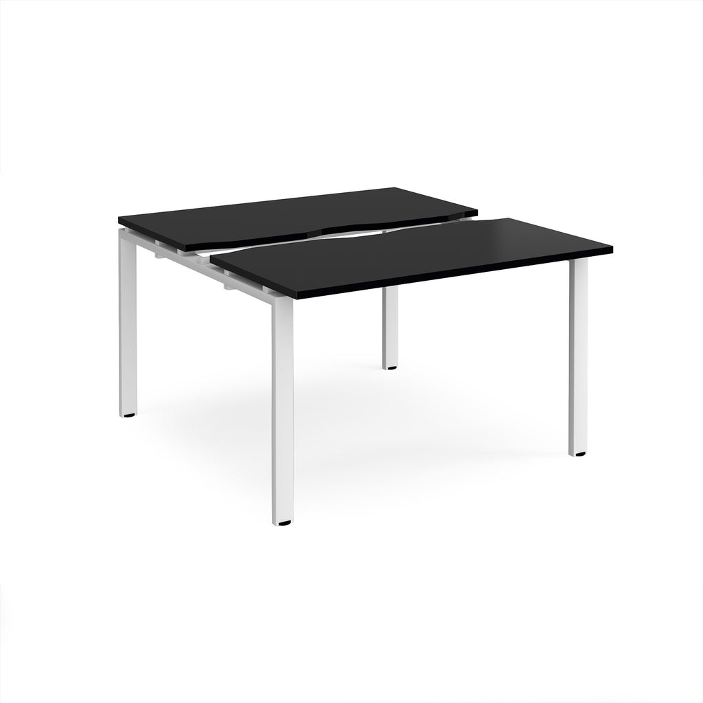Two-person back-to-back office desk with black worktops and white metal legs, shown against a white background.