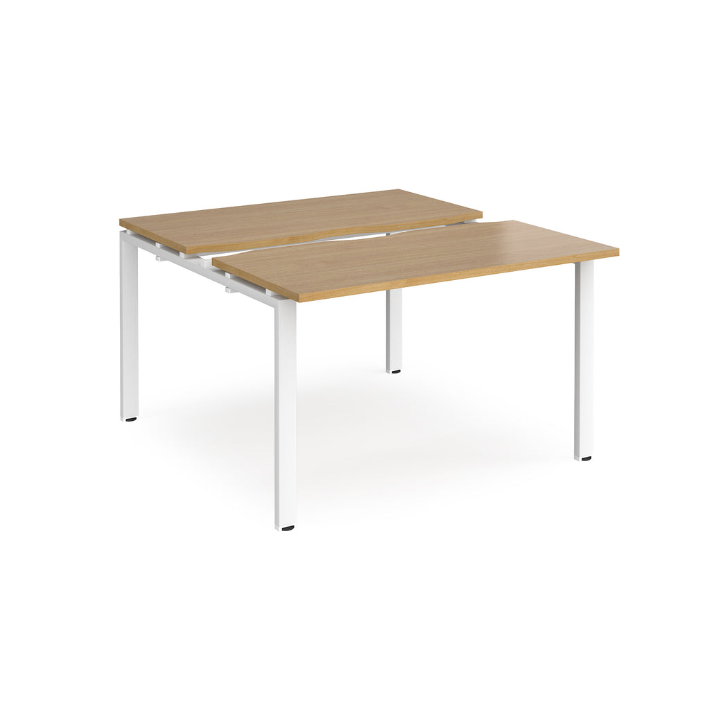 Two-person back-to-back office desk with oak-effect worktops and white metal legs, designed for shared workspace layouts.