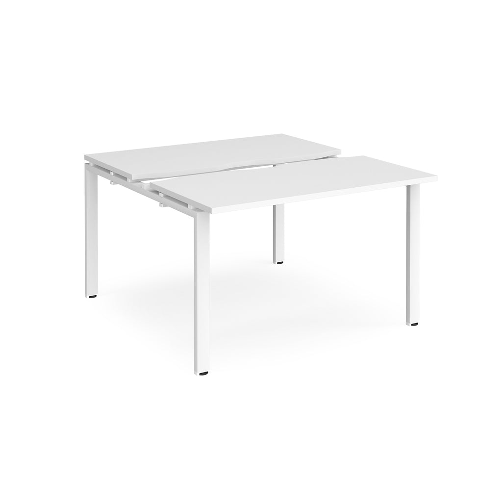 Two-person back-to-back office desk with white worktops and white metal legs, shown against a white background.