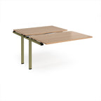 Large modular bench desk add-on with a wood-effect top and green metal legs, shown on a white background.
