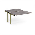 Large modular bench desk add-on with a grey wood-effect top and green metal legs, shown on a white background.