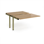 Large modular bench desk add-on with a wood-effect top and green metal legs, shown on a white background.