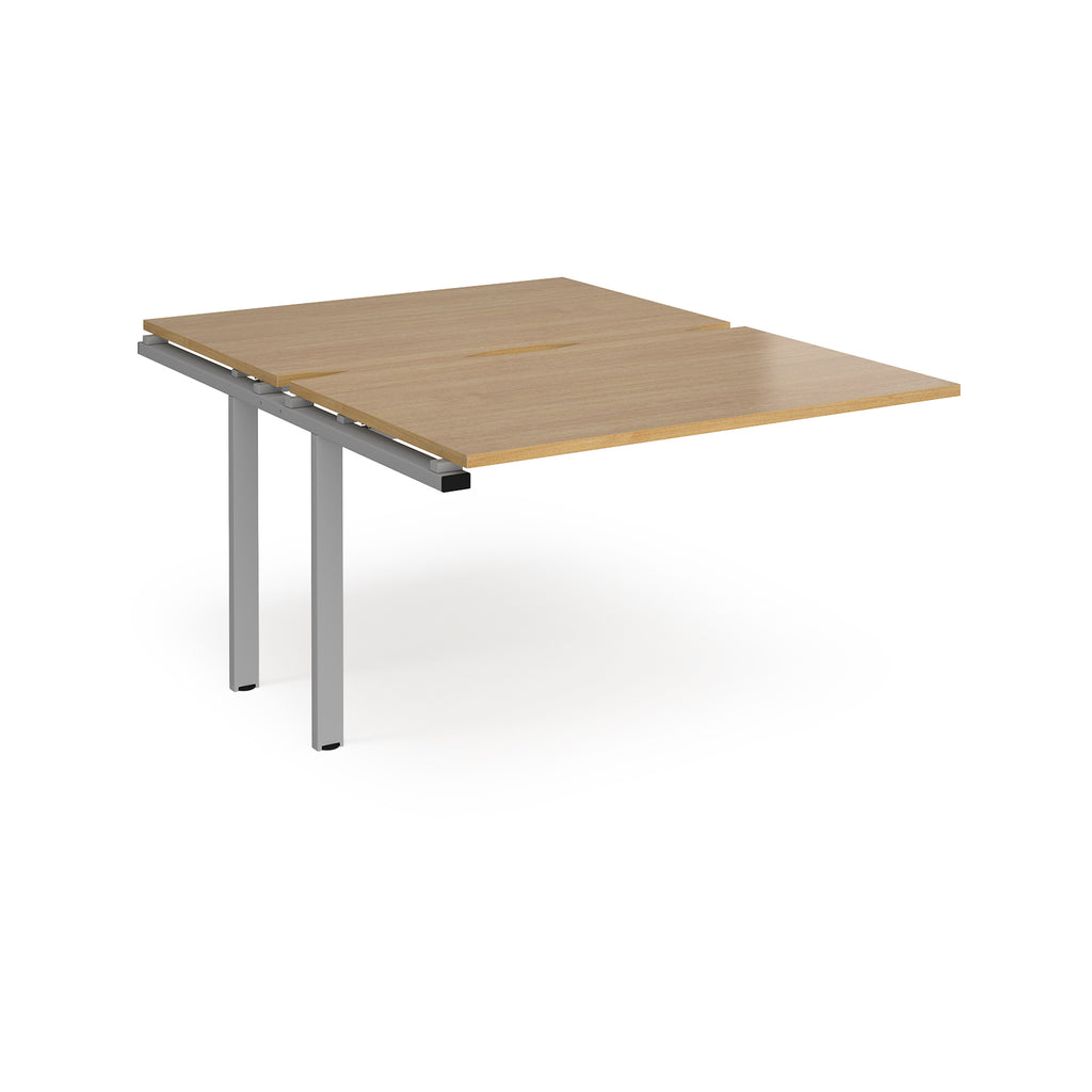 Large modular bench desk add-on with a wood-effect top and silver metal legs, shown on a white background.