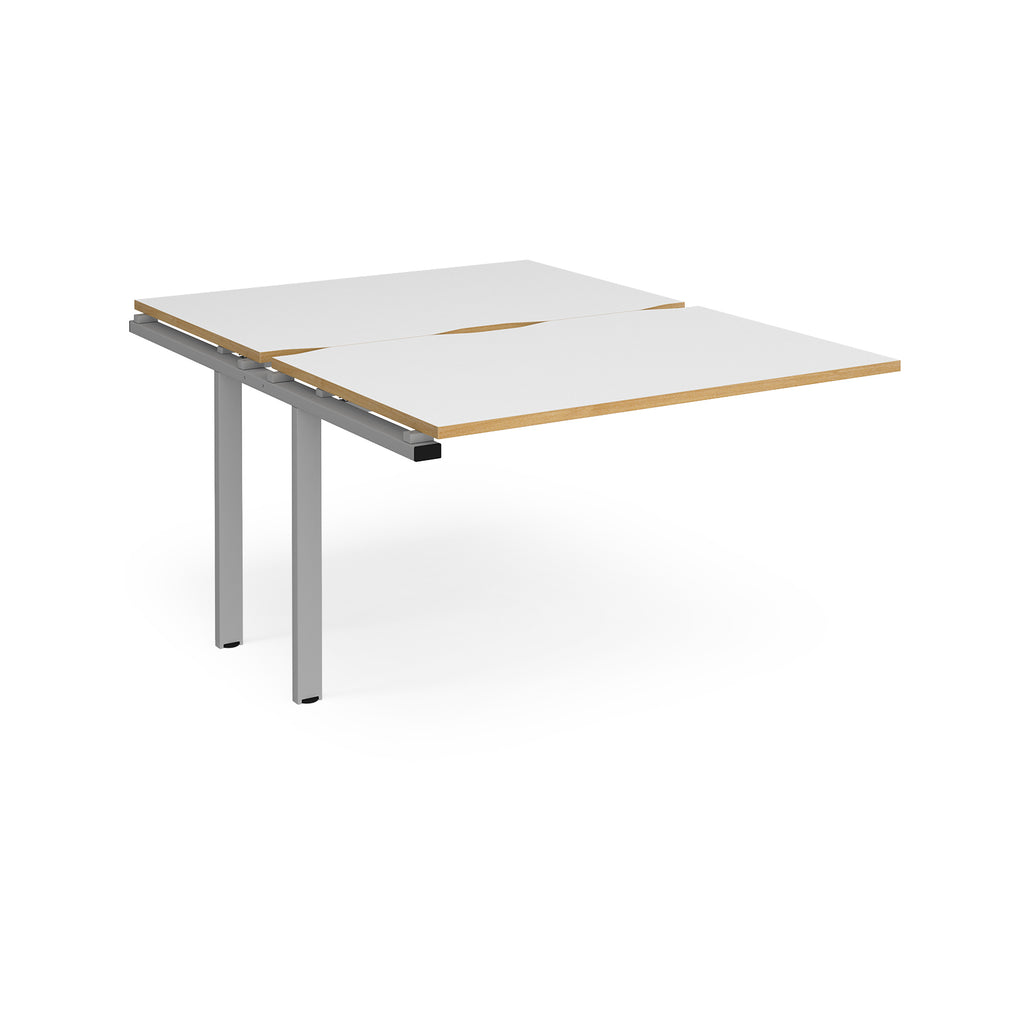 Large modular bench desk add-on with a white top with wood-effect edge, and silver metal legs, shown on a white background.