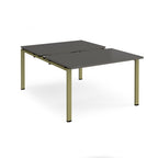 Large modular bench desk with a grey worktop, integrated cable access cut-outs, and green metal legs, shown on a white background.
