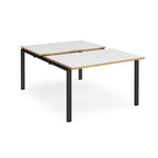 Large modular bench desk with white panels and wood-effect edging, integrated cable access cut-outs, and black metal legs, shown on a white background.
