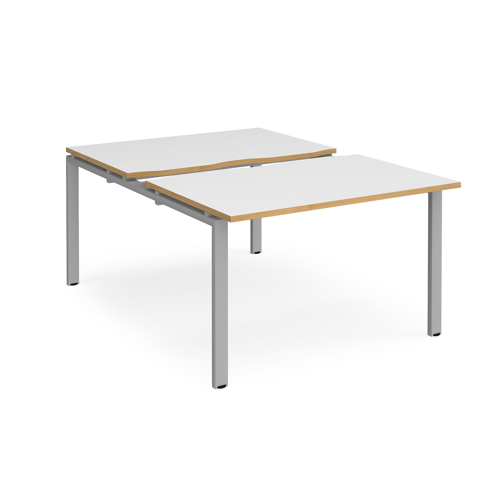 Large modular bench desk with white panels and wood-effect edging, integrated cable access cut-outs, and silver metal legs, shown on a white background.
