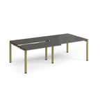 Large modular bench desk with a grey top, integrated cable access cut-outs, and green metal legs, shown on a white background.
