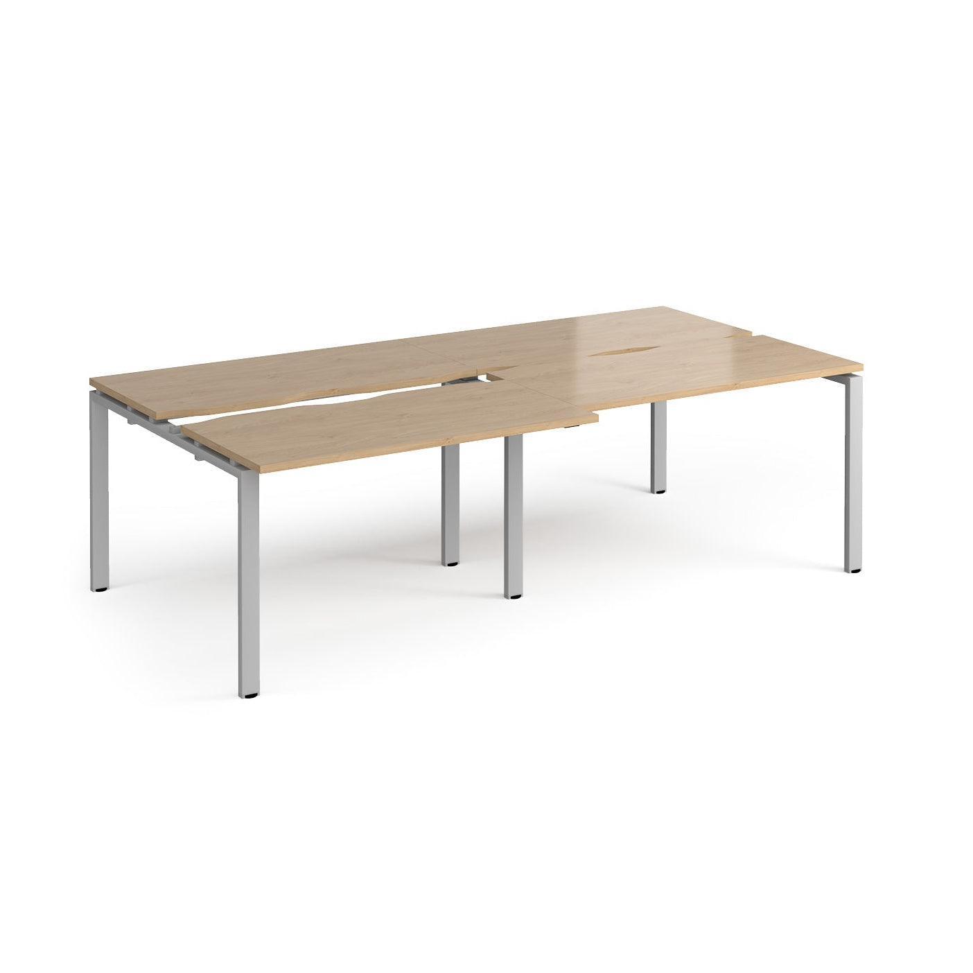 Large modular bench desk with a light oak wood-effect top, integrated cable access cut-outs, and silver metal legs, shown on a white background.
