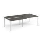 Large modular bench desk with a grey worktop, integrated cable access cut-outs, and white metal legs, shown on a white background.