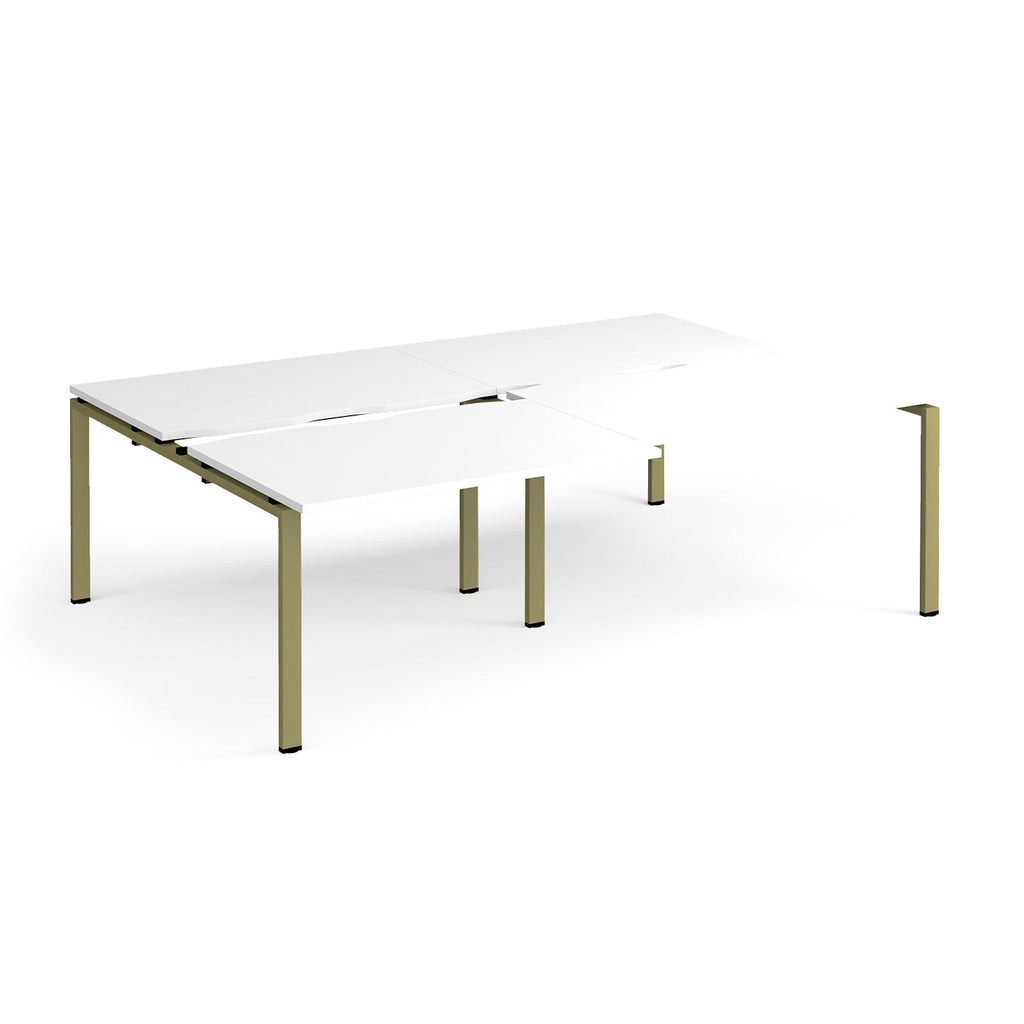 Large modular bench desk with a white worktop, integrated cable access cut-outs, and green metal legs, shown on a white background.