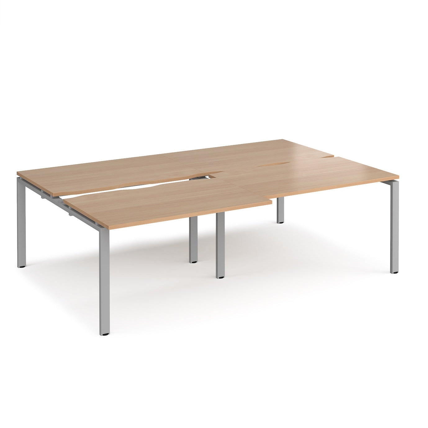 Large modular bench desk with a wood-effect top, integrated cable access cut-outs, and silver metal legs, shown on a white background.