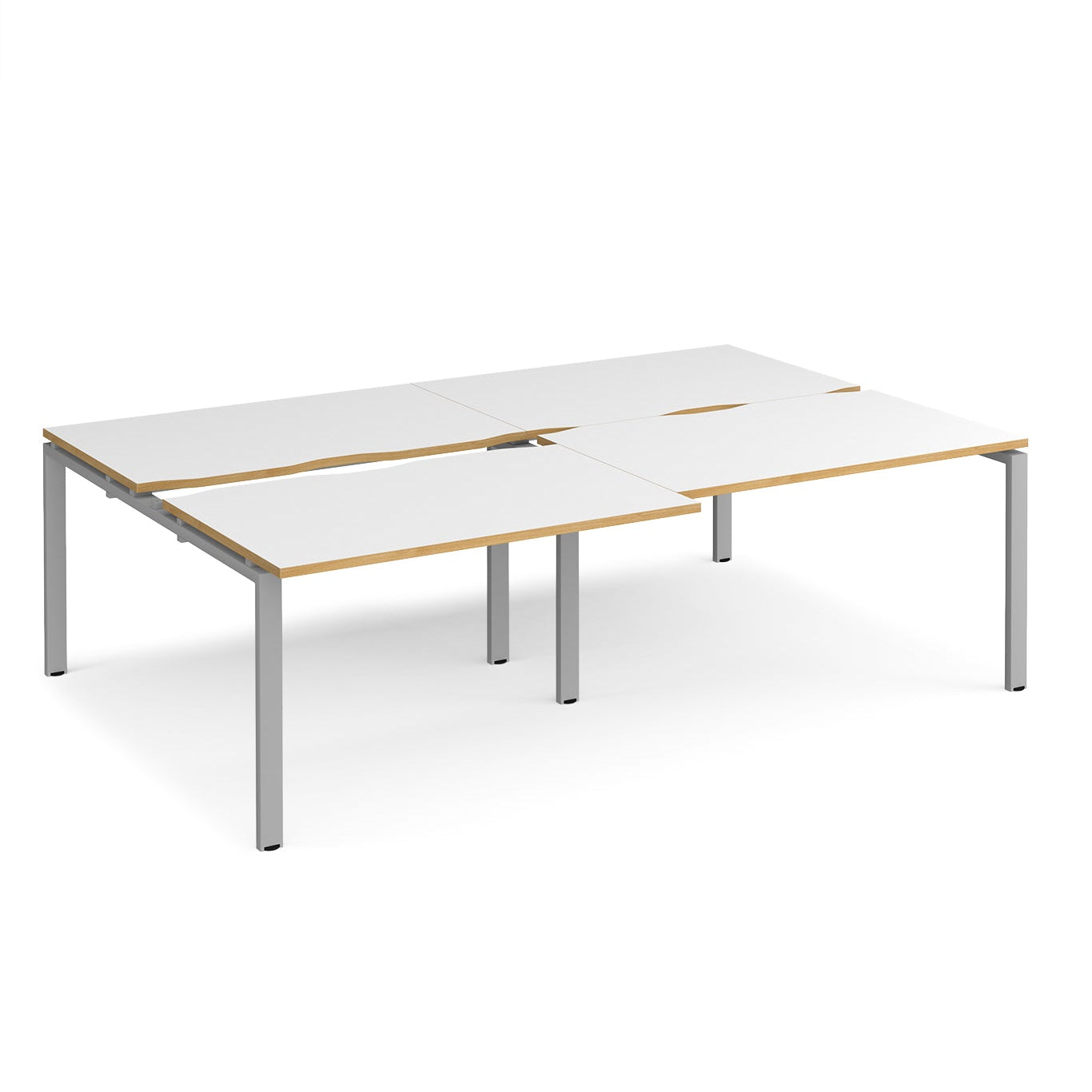 Large modular bench desk with white panels and wood-effect edging, integrated cable access cut-outs, and silver metal legs, shown on a white background.
