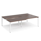 Large modular conference table with dark wood-effect panels, integrated cable cut-outs, and white metal legs, shown on a white background.