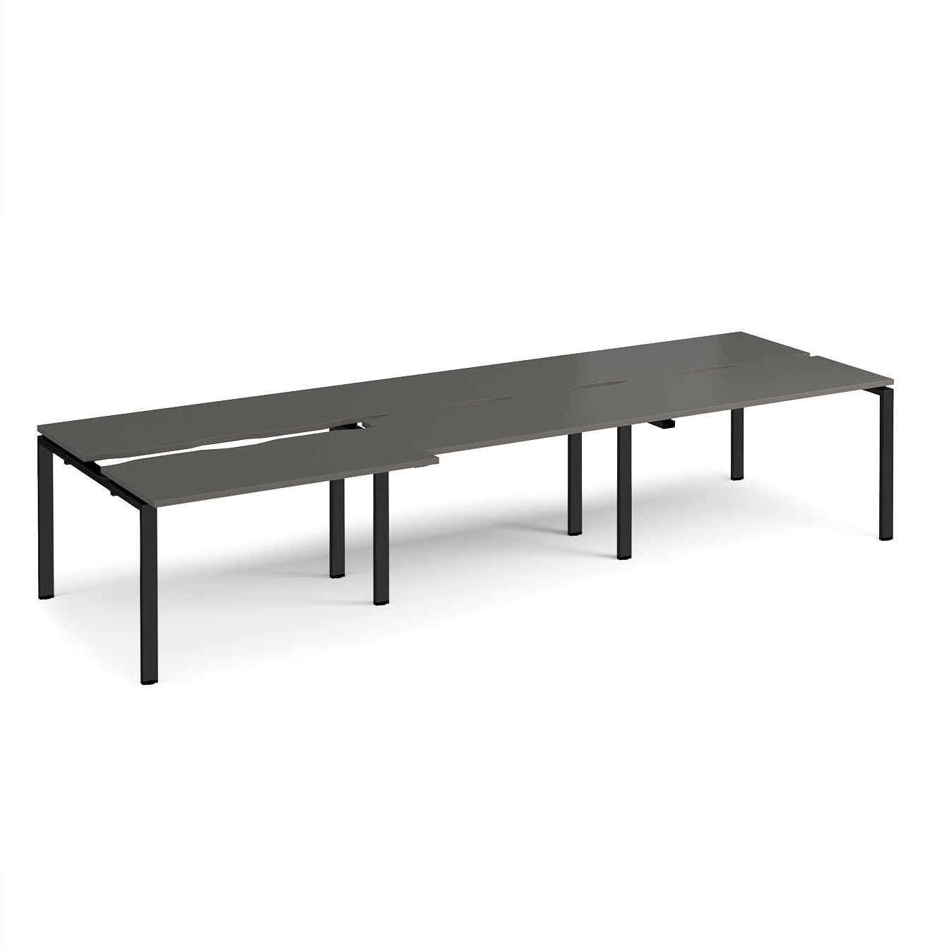 Large modular bench desk with a dark grey worktop, integrated cable access cut-outs, and black metal legs, shown on a white background.