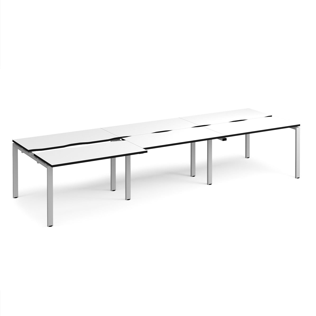Large modular bench desk with a white worktop, contrasting black edge detail, integrated cable access cut-outs, and silver metal legs, shown on a white background.