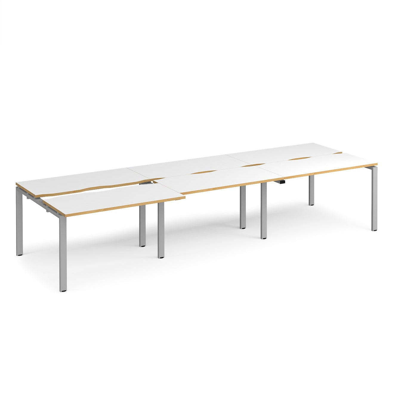 Large modular bench desk with white panels, wood-effect edging, integrated cable cut-outs, and silver metal legs, shown on a white background.