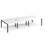 Large modular bench desk with a clean white worktop, subtle integrated cable access points, and slim black metal legs and frame, presented on a white background.
