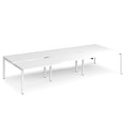 Large modular bench desk with a white worktop, integrated cable access cut-outs, and white metal legs, shown on a white background.