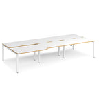 Large modular bench desk with white panels and wood-effect edging, integrated cable access cut-outs, and white metal legs, shown on a white background.