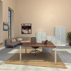Modern office setup with a desk, chair, and cabinets in a well-lit room.