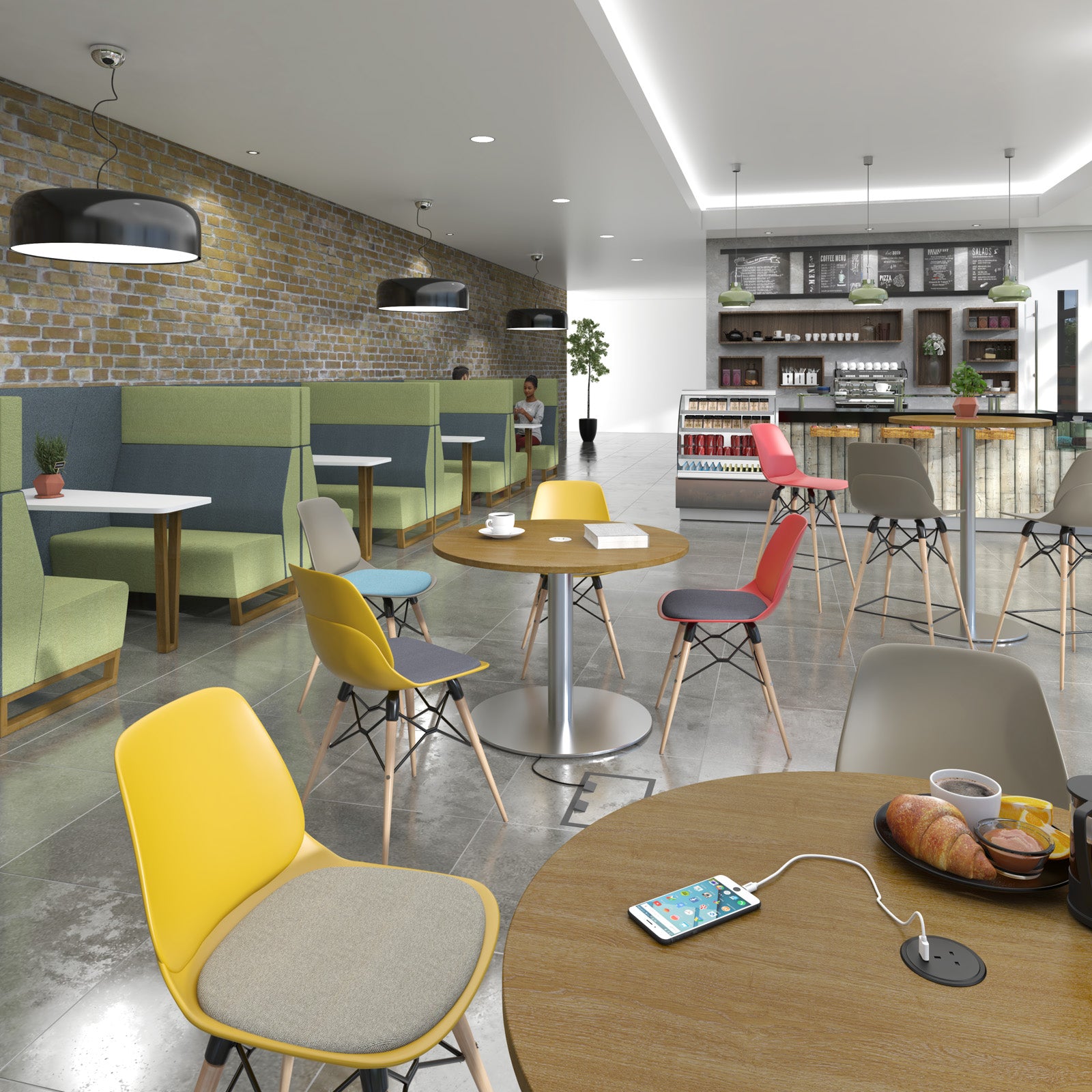 A modern café interior with multiple dining tables and colourful chairs in yellow, red, blue, grey, and green, set against a brick wall and bar area in the background.