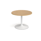 Round table with wood-effect top and white base on a white background