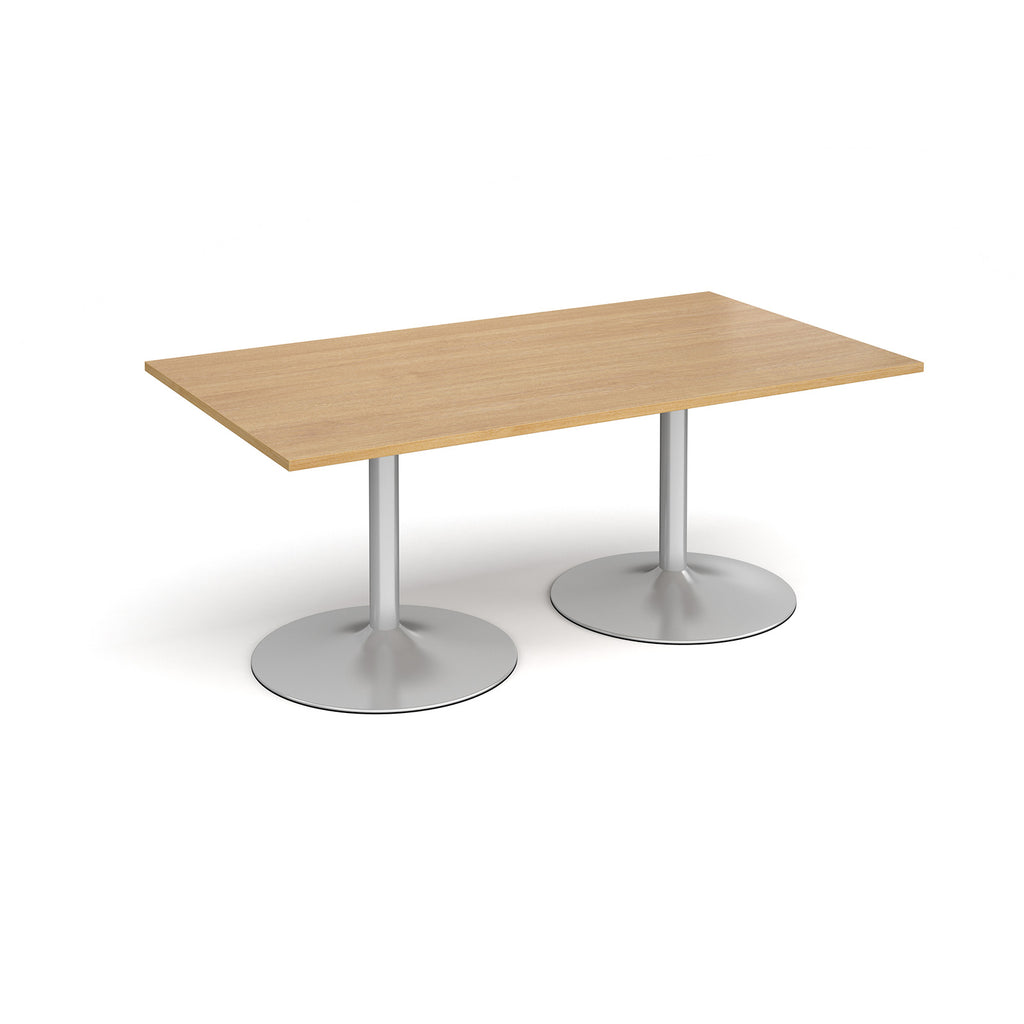 Rectangular table with wood-effect top and metal legs on a white background