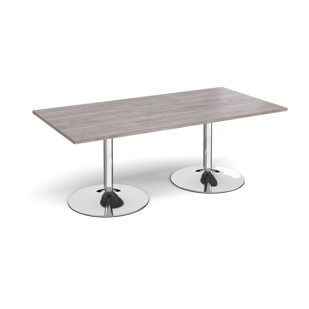 Rectangular table with grey wood-effect top and chrome base on a white background