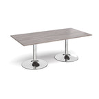Rectangular table with grey wood-effect top and chrome base on a white background