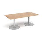 Rectangular table with wood-effect top and metal legs on a white background