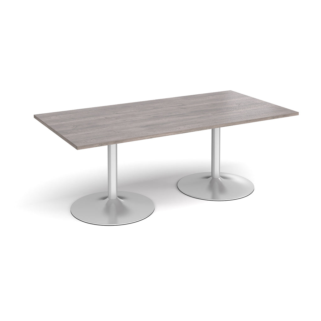 Rectangular table with grey wood-effect top and metal legs on a white background