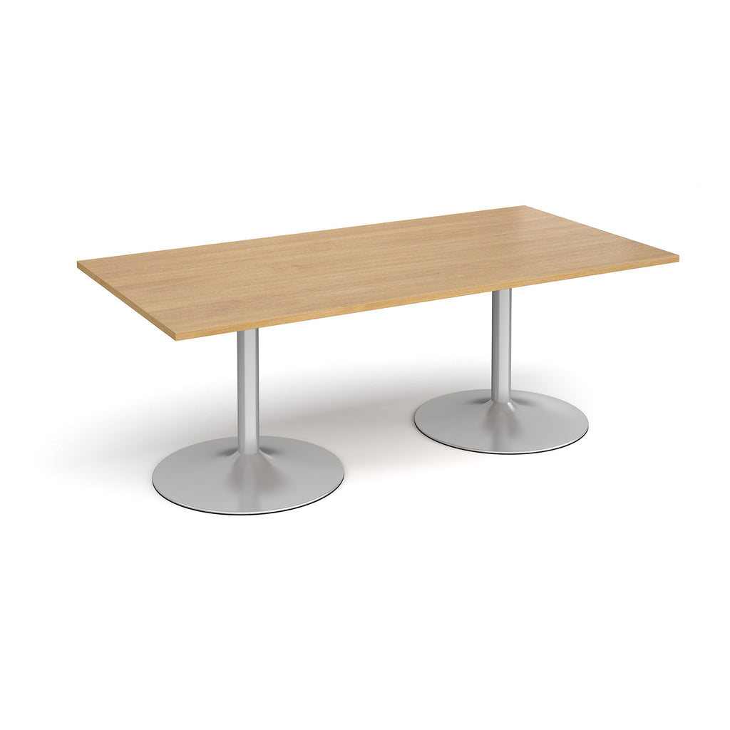 Rectangular table with wood-effect top and metal legs on a white background