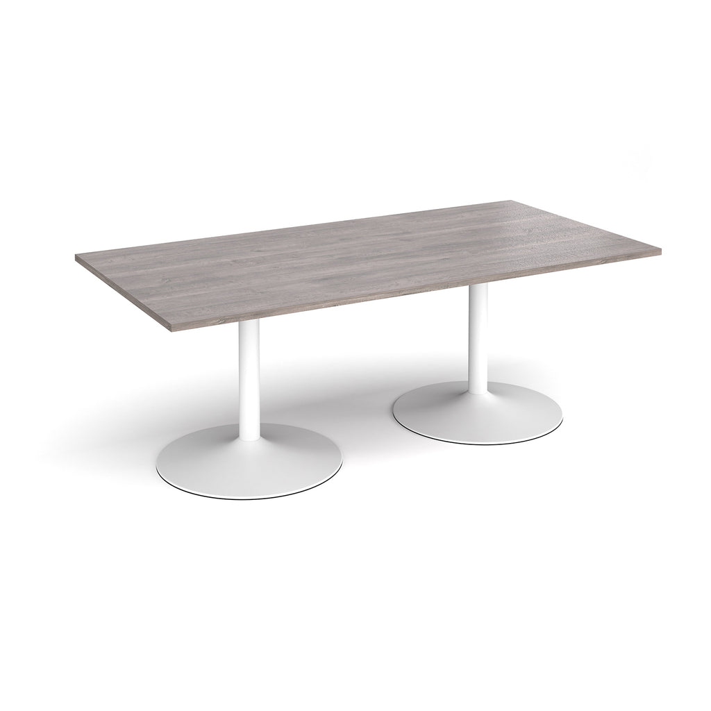 Rectangular table with grey wood-effect top and white metal legs on a white background