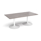 Rectangular table with grey wood-effect top and white metal legs on a white background