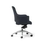 A modern black faux leather upholstered office chair with a  medium back, armrests, and a five-star chrome base with castors, shown on a white background.