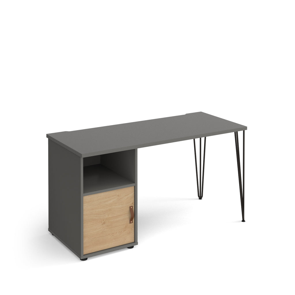 Home office desk with a grey tabletop, integrated storage unit with open shelf and wood-effect door, and slim black hairpin legs, shown on a white background.
