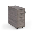 Wooden file cabinet with three drawers on a white background