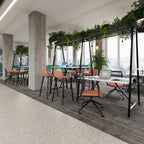 Modern office space with tables, chairs, and plants in a cityscape setting