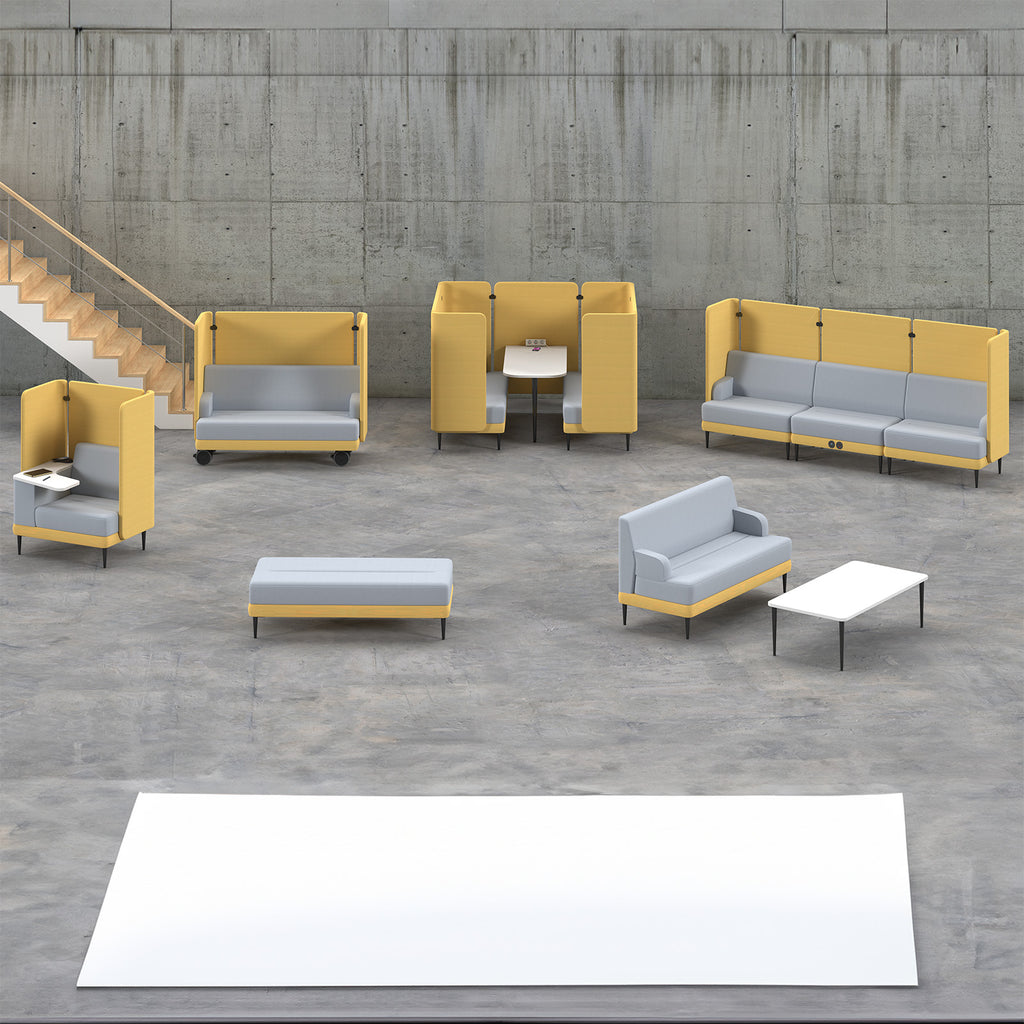 Modern office lounge seating collection with modular yellow and grey sofas, high-back booths, armchairs, and tables arranged in an open-plan space.