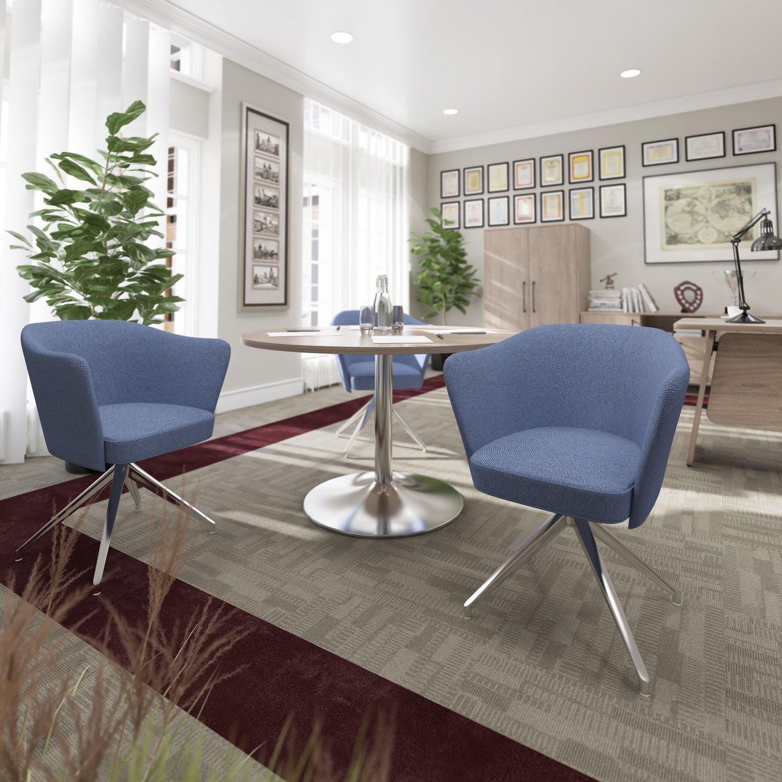 Modern office space with blue chairs, a round table, and decorative elements.