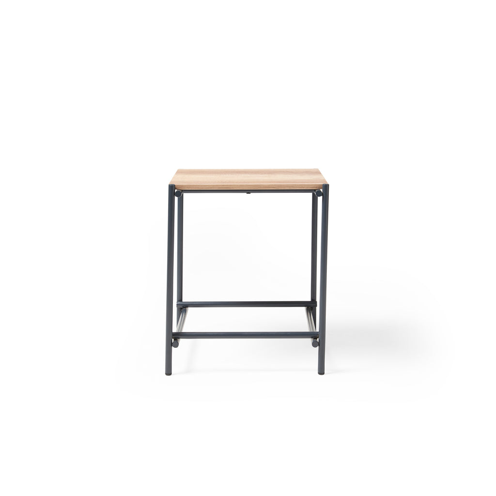 Square side table with a wood-effect top and black metal frame, suitable for office lounge or breakout areas, shown on a white background.