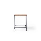 Square side table with a wood-effect top and black metal frame, suitable for office lounge or breakout areas, shown on a white background.